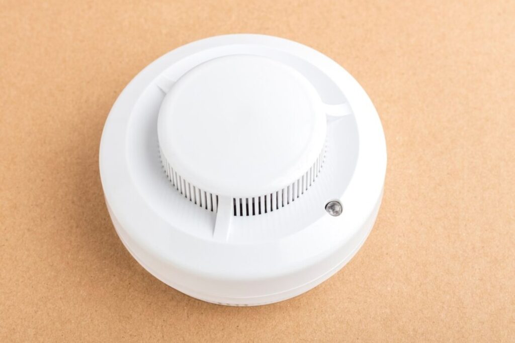 how do you stop a hardwired smoke detector from beeping